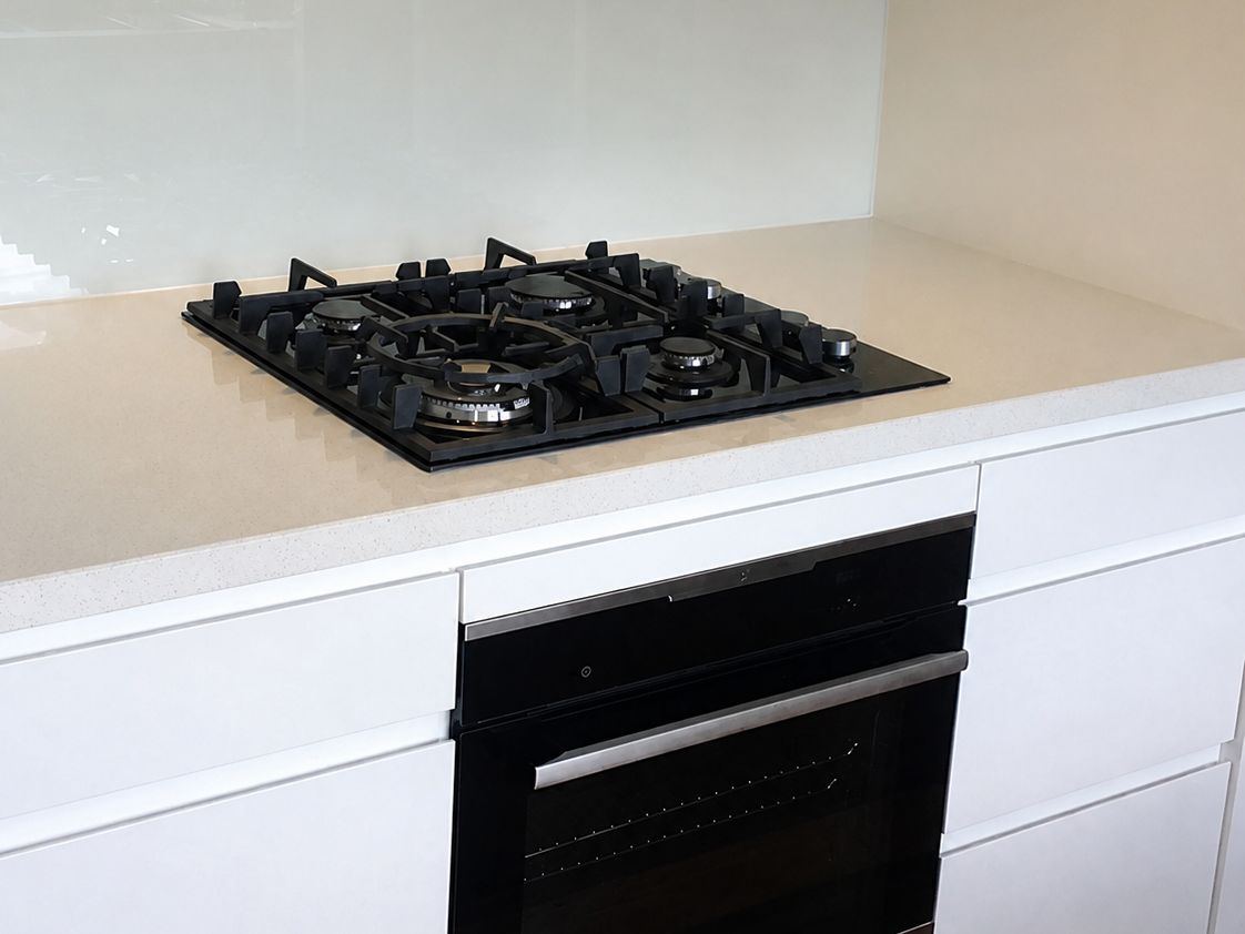 Gas cooktop and oven installed by At-Ease Plumbing
